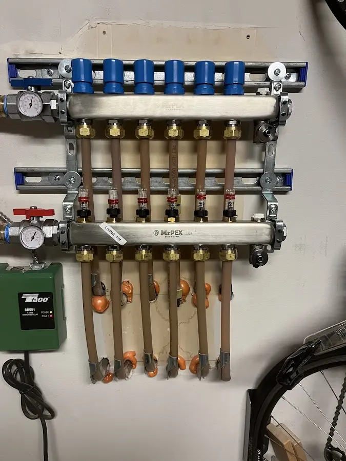 Plumber performing Water Heater Repair at a residential property in Waupun